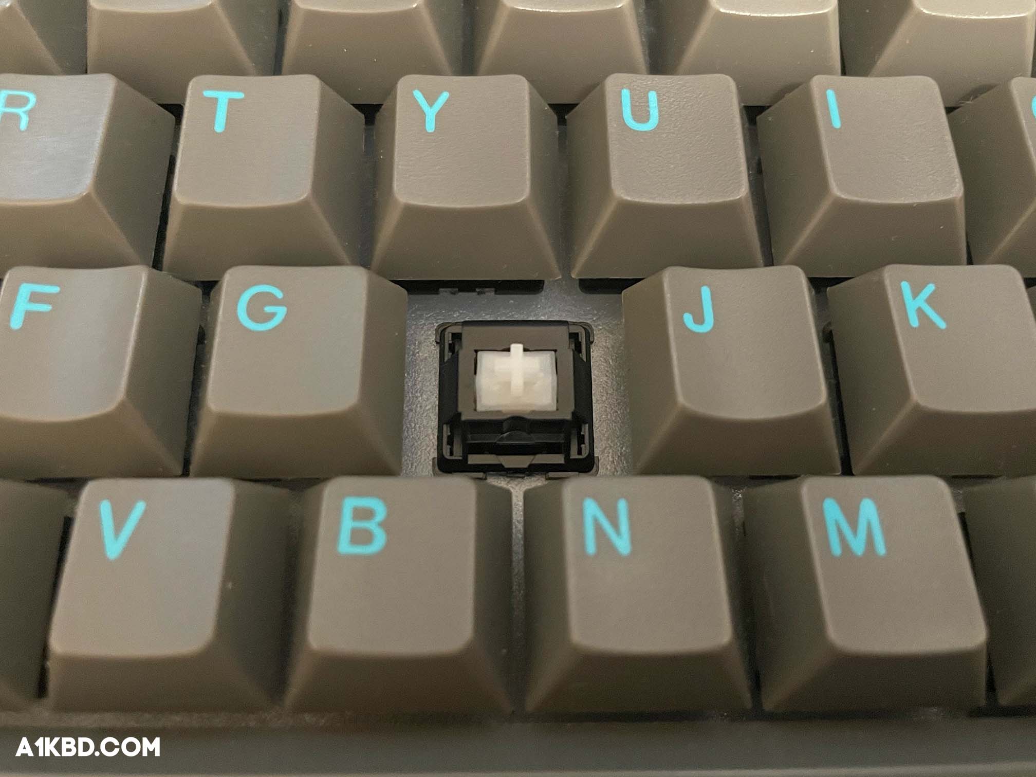 A switch secured in a mechanical keyboard.